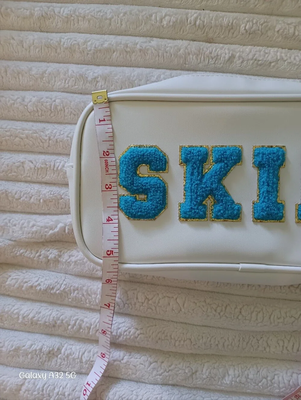 Neutrogena White Makeup Bag with Blue 'SKIN' Chenille Patch